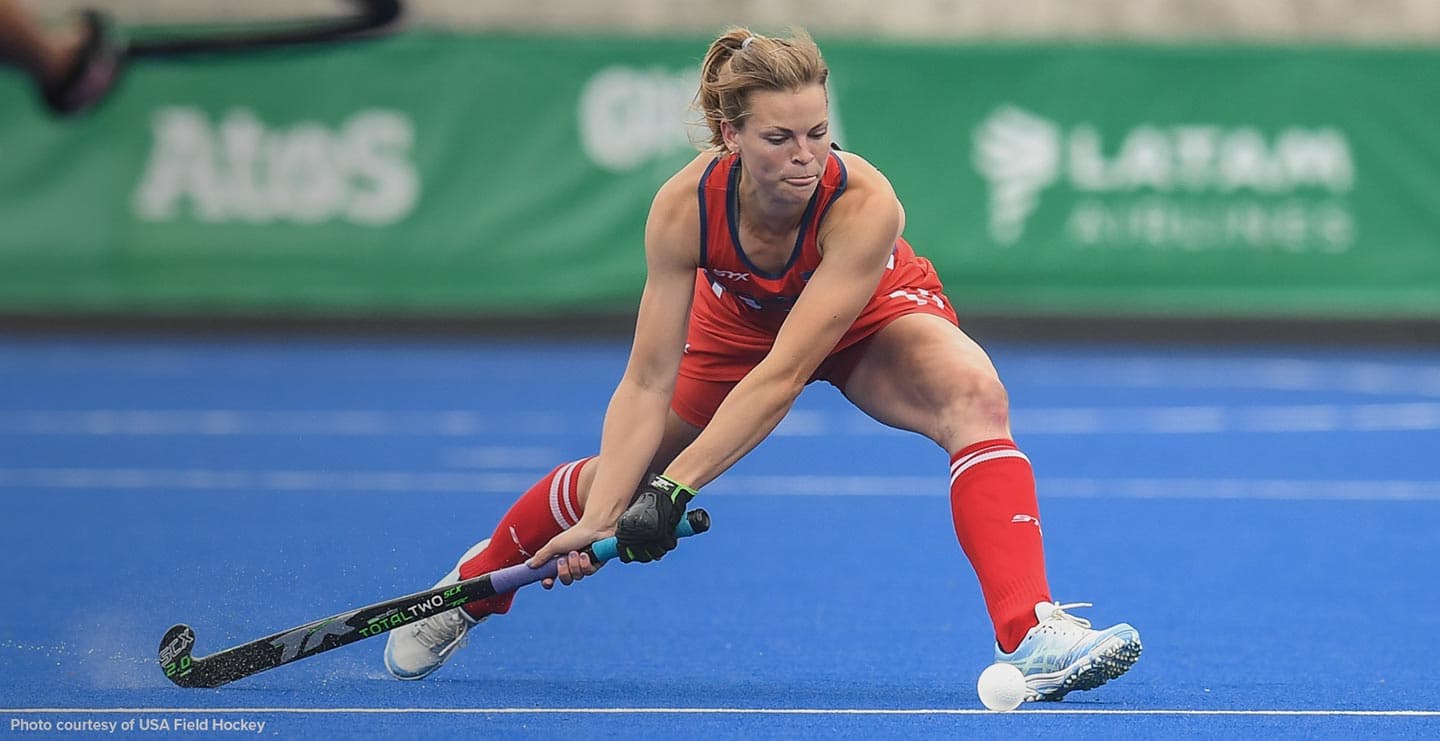 women playing field hockey