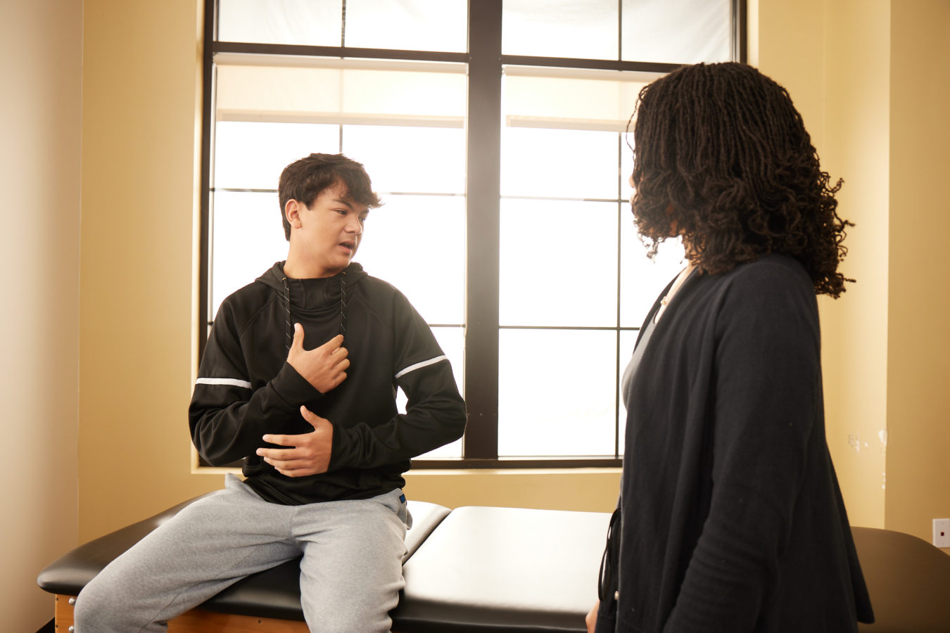 young boy during a physical therapy consultation