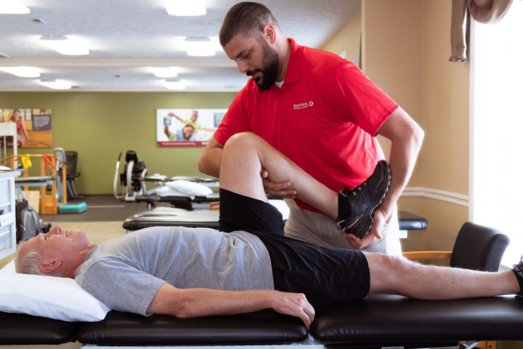 Benchmark employee treating a patient