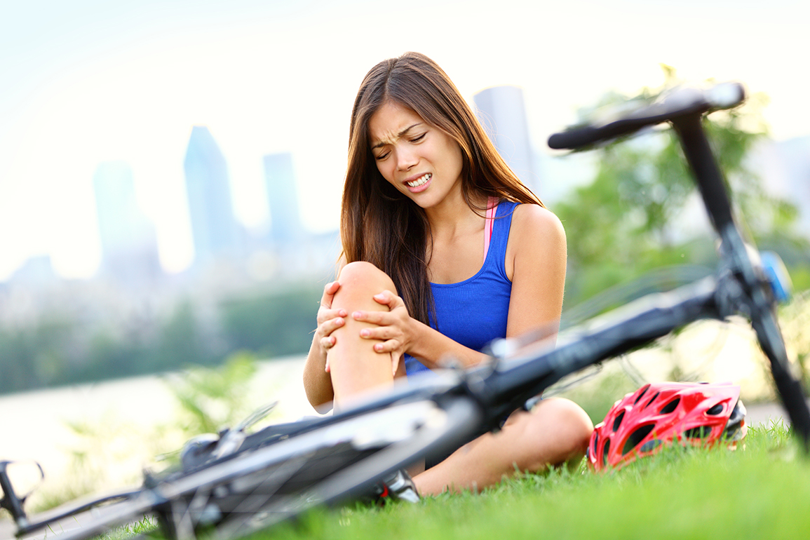Knee pain bike injury woman