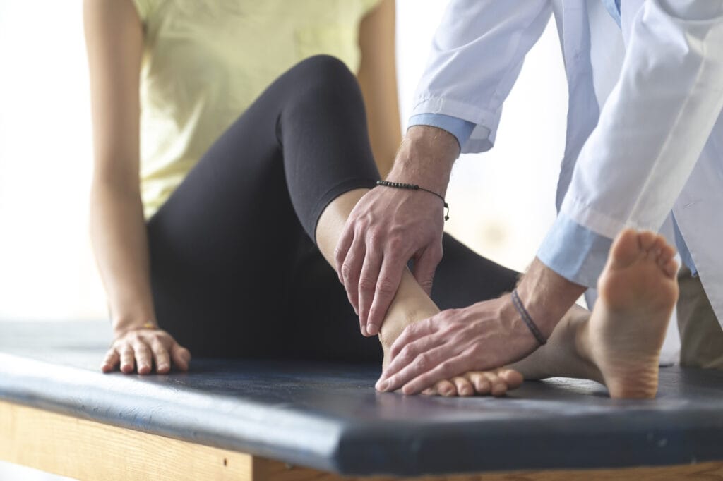 Doctor treating patient with Ankle Pain Without Injury